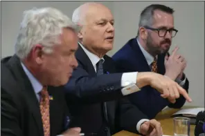  ?? (AP/Kirsty Wiggleswor­th) ?? British members of parliament Tim Loughton (from left), Iain Duncan Smith and Stewart McDonald attend a news conference in London on Monday.