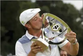  ?? MEL EVANS — THE ASSOCIATED PRESS ?? Bryson DeChambeau kisses the trophy after winning the Northern Trust golf tournament, Sunday in Paramus, N.J.