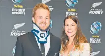  ?? Photo / Photosport ?? Sam Cane, pictured with fiancee Harriet Allen last month, has only just started running again since his October injury.