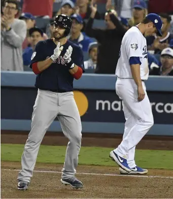  ?? CHRISTOPHE­R EVANS / BOSTON HERALD ?? READY FOR REMATCH: J.D. Martinez reacts to a hit during the Red Sox’ Game 5 victory last October in Los Angeles. The Sox face the Dodgers for the first time since the World Series, beginning tonight at Fenway.