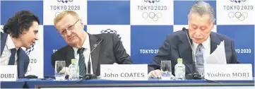  ??  ?? Coates (centre) chats with IOC Olympic Games executive director Christophe Dubi while Tokyo 2020 president Yoshiro Mori (right) attends during their joint press conference following the IOC project review meeting in Tokyo. — AFP photo