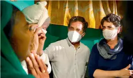  ?? —PTI ?? Congress leaders Priyanka Gandhi Vadra and Rahul Gandhi meet the family members of a 19-year-old Dalit woman who died after being allegedly raped two weeks ago, at Bulgadi village in Hathras on Saturday.