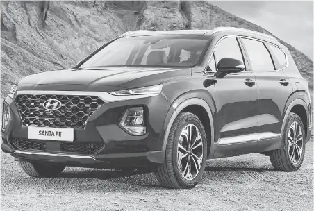  ??  ?? The new Hyundai Santa Fe is slightly larger than the previous five-passenger model and can be ordered with an “occasional-use” third-row seat.