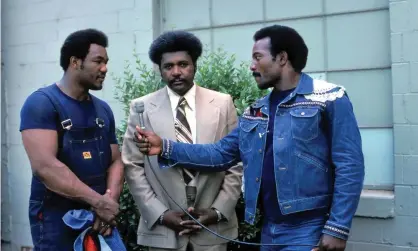  ?? Photograph: ABC Photo Archives/Walt Disney Television via Getty Images ?? Jim Brown (right) interviews George Foreman (left) and promoter Don King in 1974.