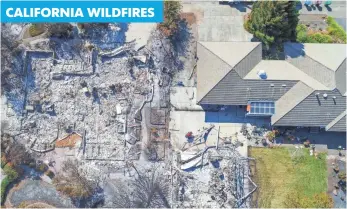  ?? JAY CALDERON AND RICHARD LUI, USA TODAY ?? In the Larkfield-Wikiup neighborho­od of Santa Rosa, Calif., one home was reduced to ash and another stands relatively untouched.