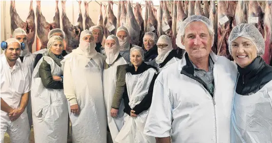  ?? PHOTO: STEPHEN JAQUIERY ?? A cut above . . . Broadleaf founders Mark and Annie Mitchell in the chiller at Duncan New Zealand’s plant at Mosgiel, with their touring American customers.