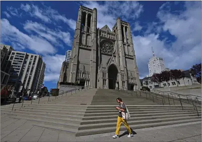  ?? PHOTOS BY JOSE CARLOS FAJARDO — BAY AREA NEWS GROUP ?? A pedestrian walks past Grace Cathedral in San Francisco.
