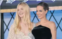  ??  ?? US actresses Angelina Jolie, right, and Elle Fanning.