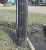  ?? Last week’s Ingham flood was just below the 2009 marker on this pole. ??