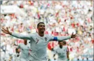  ?? FRANCISCO SECO — THE ASSOCIATED PRESS ?? Portugal’s Cristiano Ronaldo celebrates after scoring the opening goal against Morocco in the Luzhniki Stadium in Moscow, Russia, Wednesday.