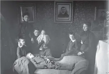  ?? WILLIAM JAMES TOPLEY/LIBRARY AND ARCHIVES CANADA ?? This portrait captures the Balcomb family, including young Warner, 9, who drowned trying to save a friend. The Citizen has told the story of his and other child deaths of early 1900s before, but never the tale of his mother, Annie. Mrs. Balcomb was...