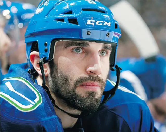  ?? JEFF VINNICK/ NHLI VIA GETTY IMAGES FILES ?? Defenceman Jason Garrison of the Vancouver Canucks, who has been asked to play the right side even though he is left- handed, now leads all Vancouver defencemen in plus- minus at plus- 12 heading into Saturday’s game in Edmonton. ‘ It’s a new...