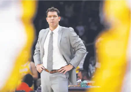  ?? Victor Decolongon / Getty Images ?? First-year Lakers head coach Luke Walton has new bosses, which could impact the length of his stay with the team.