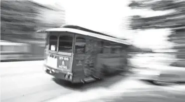  ?? RODOLFO GONZALEZ/AMERICAN-STATESMAN FILE ?? CapMetro's 'Dillo was on its last loop of downtown Austin in 2009.