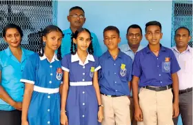  ?? Photo: Qawa Primary Shool ?? Rajnesh Swamy, Navin Kumar and Bijendra Narayan. Front row (from left) Newly inducted Deputy Head Girl Kisha Lingham, Head Girl Natasha Prasad, Head Boy Paula Gaunalagil­agi, Deputy Head Boy Austin Pillay on May 11, 2022
Back row (from left), Teachers Komal Naicker,