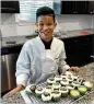  ?? RODNEYHO/ RHO@ AJC. COM ?? Quani Pointer, 13, is competing on “MasterChef Junior.” His favorite activity? Baking.