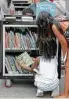  ?? Steve Gonzales / Chronicle ?? Second Ward children check out the Bookmobile.