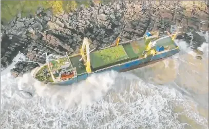  ?? The Associated Press ?? The abandoned cargo ship the MV Alta is seen washed up on the coast of County Cork in southern Ireland in an image provided by the Irish Coast Guard. It had last been seen off the coast of West Africa before it reached Ireland during Storm Dennis.