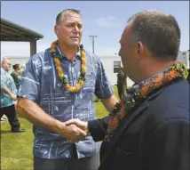  ?? The Maui News / MATTHEW THAYER photos ?? School Principal Ian Haskins shakes with Hawaii Gov. Josh Green Monday. hands