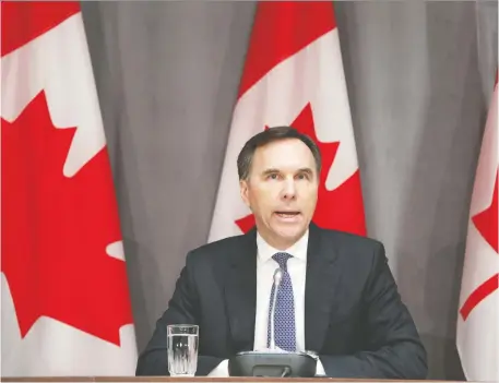  ?? DAVE CHAN/AFP VIA GETTY IMAGES ?? Canada’s Finance Minister Bill Morneau speaks during a news conference on Parliament Hill last week. The federal government is under pressure to deploy tens of billions of dollars to put companies — even entire industries — on life support while government­s effectivel­y power down non-essential elements of the global economy to stop the spread of COVID-19, Kevin Carmichael writes.