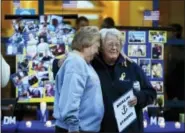  ?? ROBERT F. BUKATY — AP PHOTO ?? Deborah Dyer, right, is hugged by Judy Marzolf prior to vigil of hope held at Maine Maritime Academy for the missing crew members of the U.S. container ship El Faro, Tuesday evening, in Castine, Maine. Dyer’s nephew, Dylan Meklin, of Rockland, Maine,...