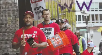  ?? STAFF PHOTOS BY NICOLAUS CZARNECKI ?? CONTRACT FIGHT: Hotel workers, above and below, protest yesterday outside the W Hotel in Boston. Workers at hotels in San Francisco and San Jose joined in the cause yesterday.