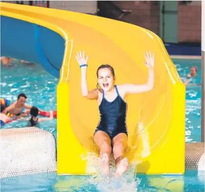  ?? Picture: Fraser Band. ?? A youngster enjoys the new flumes at Perth Leisure Pool.