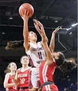  ?? BEN HASTY — MEDIANEWS GROUP ?? Gov. Mifflin’s Elisa Fiore shoots against Wilson’s Jasilyn Moncada during the Mustangs’ win over the Bulldogs.