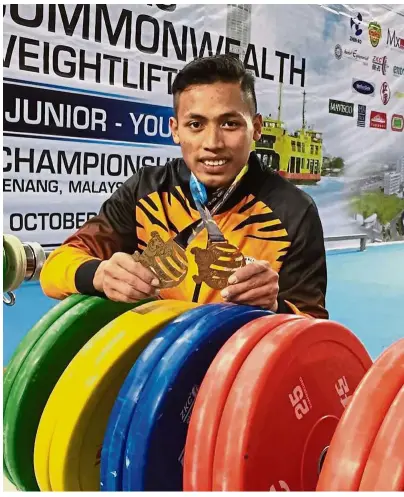  ??  ?? Tough luck: Muhd Zaidi Nordin is one of the three national weightlift­ers tested positive for doping after a surprise testing done by the IWF.