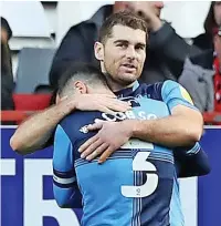  ?? ?? A HUG’S GAME Wycombe’s Sam Vokes is hugged after his goal