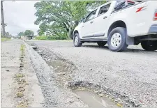  ?? Picture: JONA KONATACI ?? Potholes along Daniva Rd in Valelevu, Nasinu need to be filled.