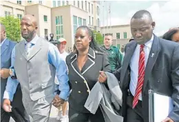  ?? RED HUBER/ORLANDO SENTINEL ?? Trayvon Martin’s parents, Tracy Martin, left, and Sabrina Fulton leave the Seminole County courthouse with attorney Benjamin Crump in April 2021.
