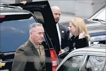  ?? Win McNamee Getty Images ?? JOINT CHIEFS Chairman Gen. Joseph F. Dunford Jr. and Homeland Security Secretary Kirstjen Nielsen leave the White House. President Trump signaled he was on the verge of ordering a U.S. strike against Syria.