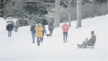  ??  ?? People descend on Barnes Park in Sunderland yesterday morning to have fun in the snow. Picture by North News