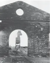  ?? H Milburn ?? A 1964 view from inside Carlisle Canal’s roundhouse, out towards the coaling tower, as the wreckers pause in their work of destructio­n. The physical remains of 102 years of history, of so many men and machines, are being forever erased – but the memories linger on.