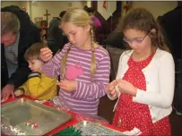  ?? SUBMITTED ?? Pictured several years ago at a “Children’s Holiday Gift-Making Workshop” are, from left, Liam Ruddock and Siri and Gemma Caruso.