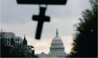  ??  ?? The US Capitol Building is seen following a Senate vote on the coronaviru­s relief bill, on Capitol Hill in Washington yesterday.