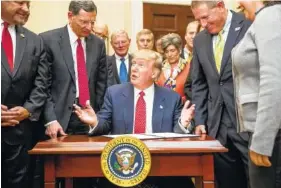  ??  ?? President Donald Trump speaks as he signs the Waters of the United States executive order Tuesday in the White House.