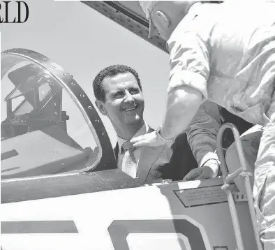  ?? SYRIAN PRESIDENCY FACEBOOK PAGE / AFP / GETTY IMAGES ?? Syrian President Bashar al-Assad sits inside a Sukhoi Su-27 jet during a recent visit to the Russian-run Hmeimim military base. The White House warned Syria on Monday against further use of chemical weapons.