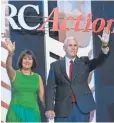  ?? MOLLY RILEY, AP ?? GOP vice presidenti­al hopeful Mike Pence and his wife, Karen, take the stage Saturday.