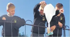  ?? ?? Daniel, Dominiks and Silvestras from 5th class, exploring parachutes in science.