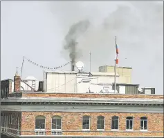  ??  ?? Black smoke billows from a chimney on top of the Russian consulate in San Francisco, California. — AFP photo