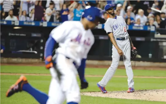  ?? | FRANK FRANKLIN II/ AP ?? Cubs relief pitcher Carl Edwards Jr. reacts as he watches a home run by the Mets’ Curtis Granderson in the eighth inning Wednesday in New York.