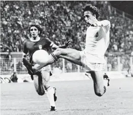  ??  ?? Dutch legend Johan Cruyff volleys home for Holland in their World Cup 1974 semi-final group tie match against Brazil. The Netherland­s won 2-0 to reach the final.