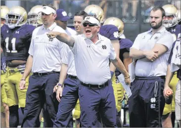  ?? JOE RAYMOND / ASSOCIATED PRESS ?? Notre Dame’s Brian Kelly has largely called his own plays in his 24 seasons as a college head coach (he’s entering his sixth with the Irish), but two assistants will help him with the play-calling this season.