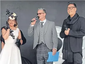  ??  ?? Gillian Wilson from Ayr in her winning outfit on stage with DJ Stuart Webster and Gok Wan.