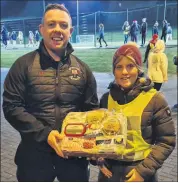  ?? ?? Edward Horgan presenting a hamper to Geraldine Williams following the club’s MyLife/GAA Challenge.