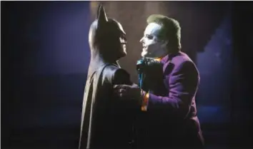  ??  ?? Michael Keaton as Batman and Jack Nicholson as The Joker in 1989's “Batman”