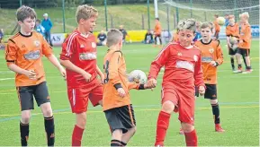  ??  ?? Age 11 DUSC (tangerine) and Brechin faced off at Craigie 3G recently.