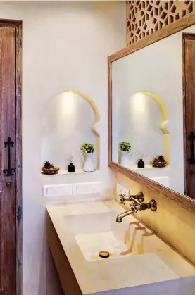  ??  ?? The clean design and the white flawless mirror speaks volumes. The arched shaped space adds a royal tag.